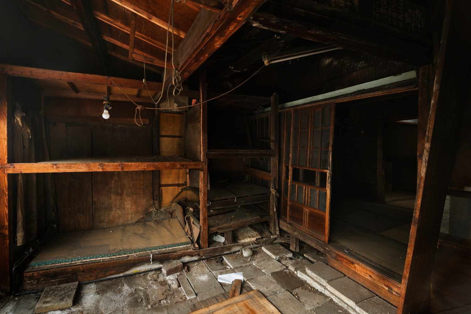 Soot-stained, damaged wooden interior structure showing need for disaster cleanup.