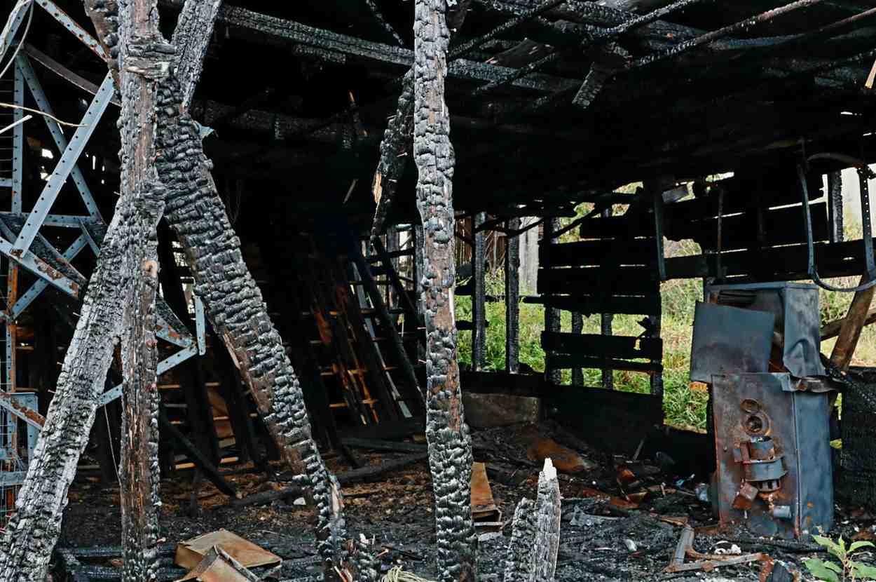 Severe structural fire damage showing completely charred wooden beams and property debris requiring restoration in Rockville.