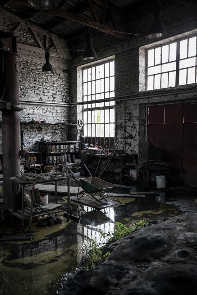 Flooded commercial warehouse showing severe water damage.