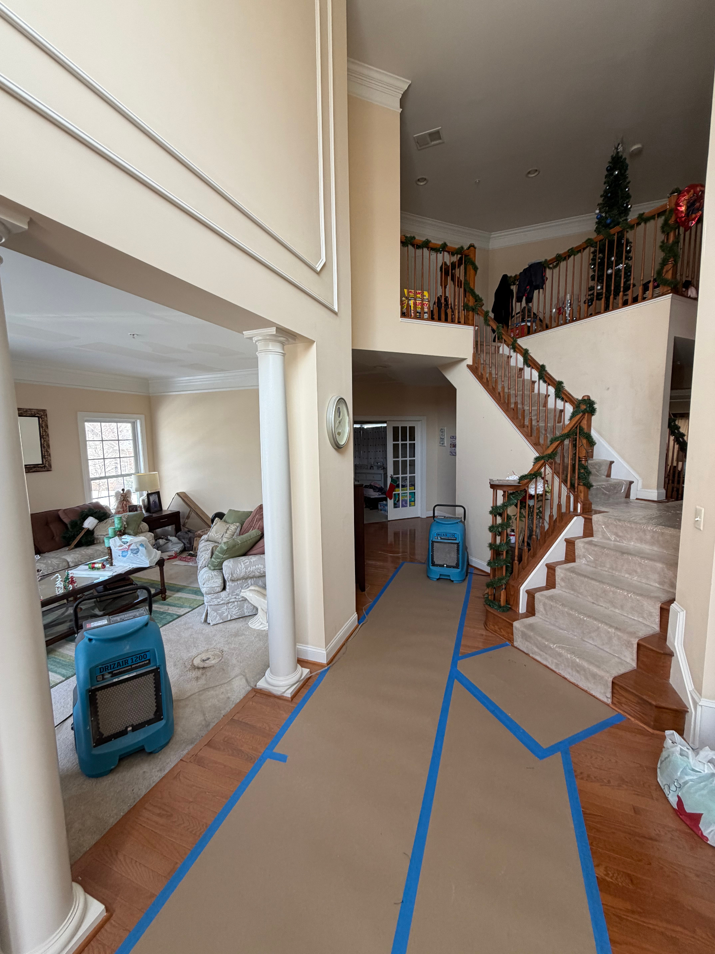 Residential drying setup in foyer with air movers