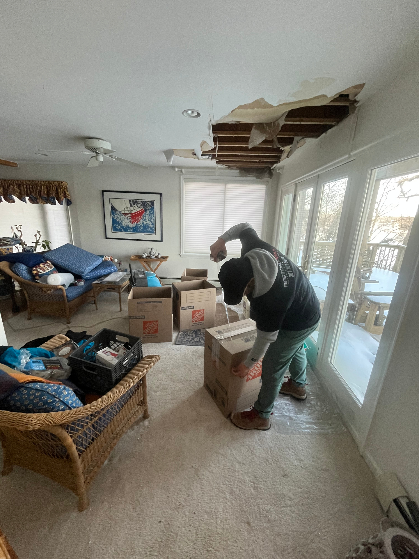 Ceiling collapse from water damage – pack-out in progress