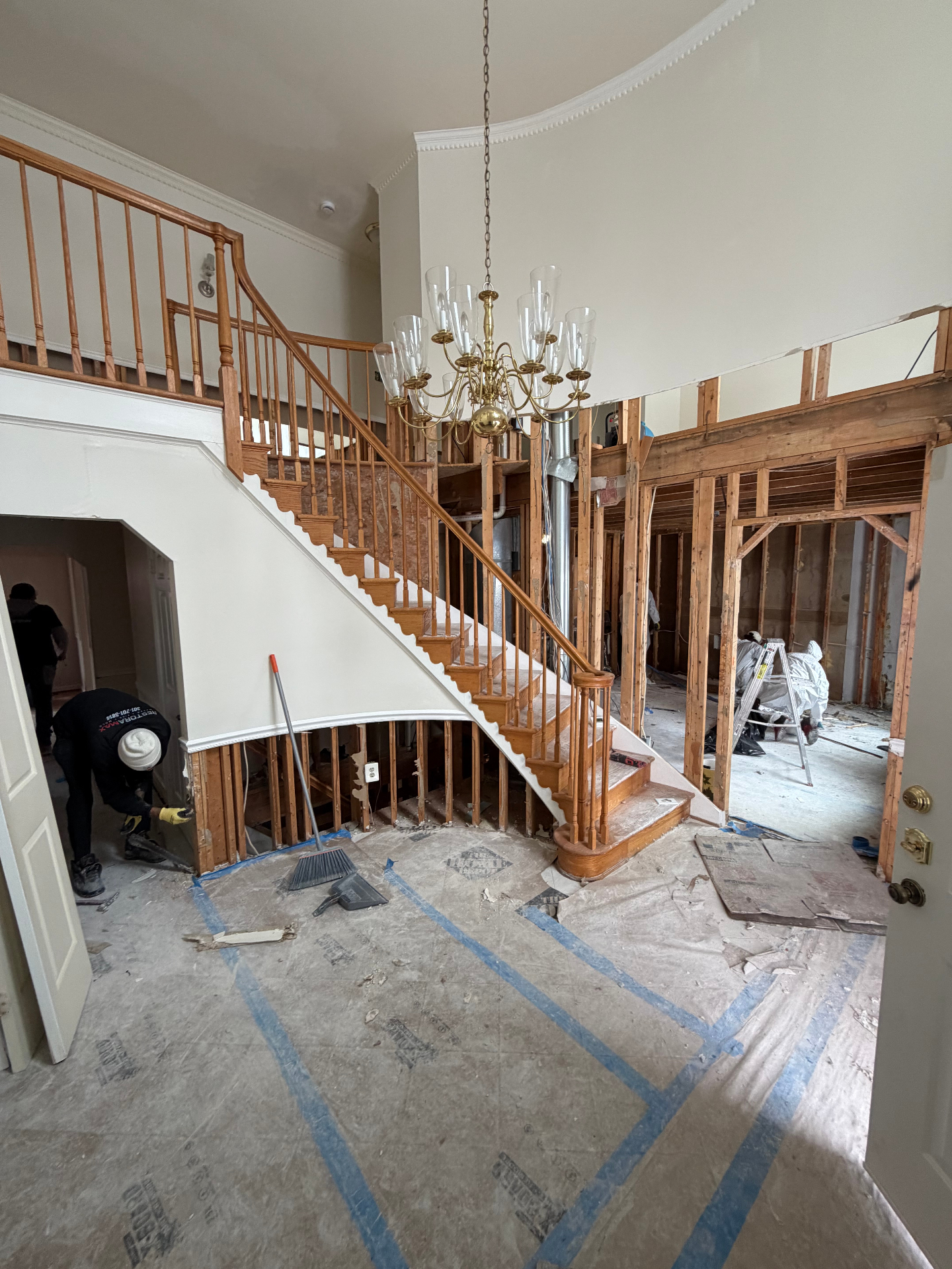 Large-scale interior demolition – foyer with exposed framing