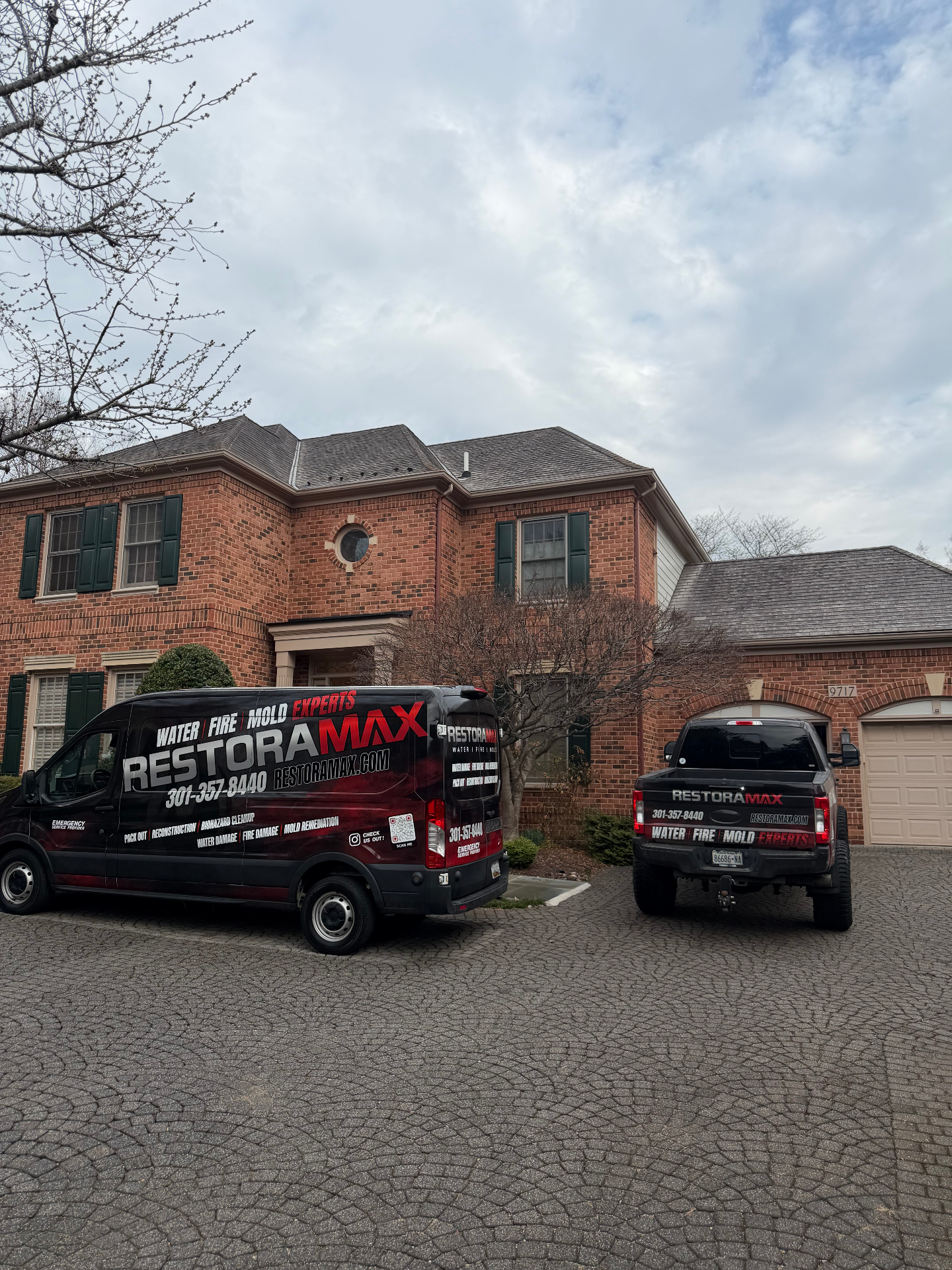 RestoraMax fleet vehicles at residential job site